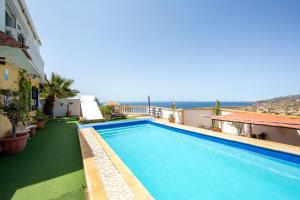 a large swimming pool on the side of a building at Vista al Mar Ainara in Almería