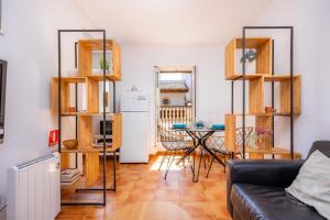 a living room with a couch and a table at Apartamento Can Jaume in Artá