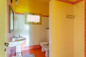 a bathroom with a sink and a toilet at Tramonto al Rifugio Arcobaleno in Popiglio +15 photos