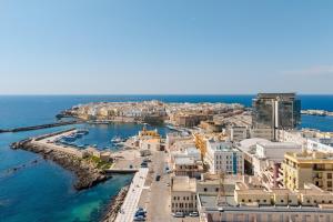 an aerial view of a city and the ocean at Palazzo Mongiò in Gallipoli