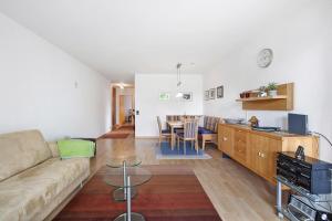a living room with a couch and a table at Fewo Waldfee in Höchenschwand