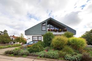 a house with a lot of plants in front of it at Haus Müller in Böhringen