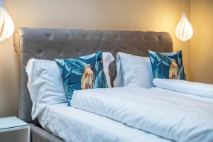 a couple of beds with pillows on them at Loft Lauben in Bressanone