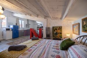 a bedroom with a large bed in a room at La Fabriqueta Apartament Loft in Ríudecañas +17 photos