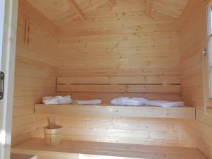 a wooden sauna with two beds in it at Ferienhaus am Rheinpark in Kamp-Bornhofen