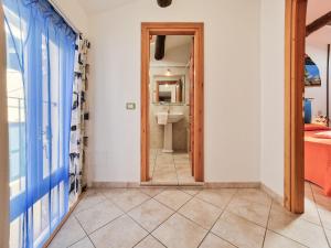 a bathroom with a toilet and a mirror at Il Borgo 4 in Capoliveri +15 photos