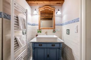 a bathroom with a sink and a mirror at Hof Diederichs in Bohmstedt +25 photos