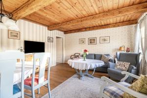 a living room with a couch and a table at Hof Diederichs in Bohmstedt