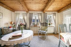 a living room with a table and chairs at Hof Diederichs in Bohmstedt