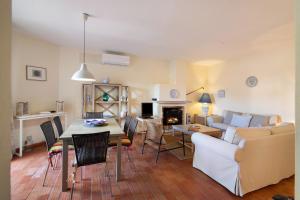 a living room with a couch and a table at Casa Allan in Vale do Lobo