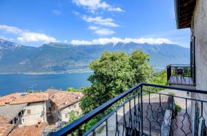 a balcony with a view of the lake and mountains at Casa Doss in Tremosine Sul Garda