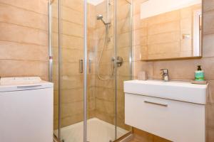 a bathroom with a shower and a sink at Casa Doss in Tremosine Sul Garda