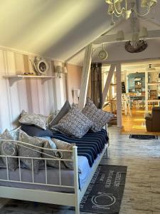 a bed with pillows on it in a room at Thüringer Landidyll in Bösleben-Wüllersleben