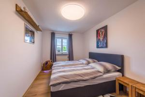 a bedroom with a bed in a room at Ferienwohnung Parzinger 2 in Chieming