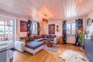 a living room with a couch and a table at Ferienwohnung Parzinger 2 in Chieming