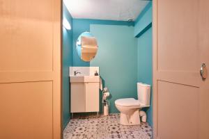 a small bathroom with a toilet and a mirror at Gîte Les Dames in Mens +17 photos