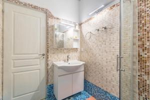 a bathroom with a toilet and a sink and a shower at Victoria's House in Gaios +15 photos