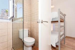a bathroom with a toilet and a shower at Casa de Ses Roques in Ciutadella +23 photos