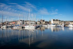 a bunch of boats are docked in a harbor at Glycine in Paimpol +16 photos