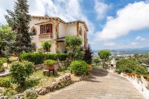 a house on a hill with a road at Tresa in Lloret de Mar