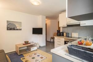 a kitchen with a sink and a counter top at Haus Afaldra in Mengen