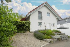 a white house with a garden in front of it at Haus Afaldra in Mengen