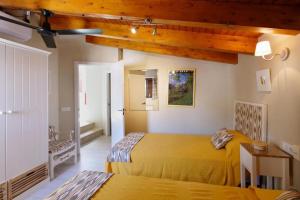 a bedroom with two beds in a room at Can Teresa in Capdepera +24 photos
