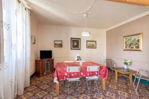 a dining room with a table and chairs at Masia Cal Vies in Castellví de la Marca
