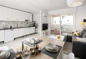 a living room with a couch and a table at Casa Chana in Almuñécar
