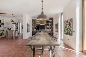 a large wooden table in a room at Cortijo La Almazara in Ronda