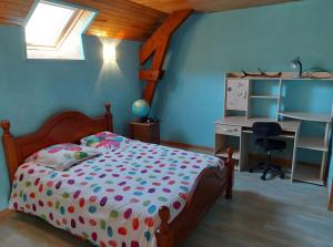 a bedroom with a bed and a desk at Séjour Nature à Campan in Campan