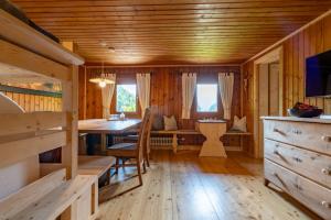 a wooden room with a table and a dining room at Chalet Kasern in Gais +33 photos