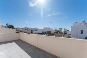 a balcony with a view of a city at Chalet con Piscina in Orihuela Costa