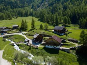 an aerial view of a small village in the mountains at Chalet Kasern in Gais