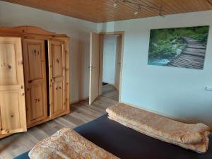 a room with a bench and a painting on the wall at Ferienwohnung Reinbold in Durbach