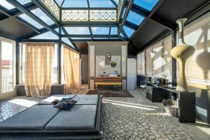 a bedroom with a large bed and a bathroom at Maison boutique At Pietro in San Pietro in Lama