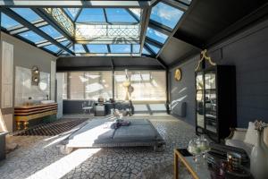 a bedroom with a bed in a room with a skylight at Maison boutique At Pietro in San Pietro in Lama +25 photos