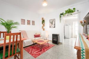 a living room with a couch and a table at La Casa De Eva in Gaucín