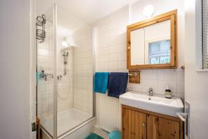 a bathroom with a sink and a shower at Klosterhof Eggenreute in Wangen im Allgäu +26 photos