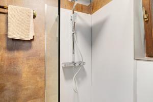 two pictures of a shower in a bathroom at Haus Erika Ferienwohnung 1 in Bad Teinach-Zavelstein +30 photos