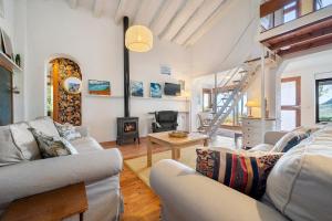 a living room with two couches and a fireplace at Casa Mariti in Mont-ral