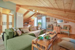 a living room with a couch and a table at Zante Villa Amici Loft in Zakynthos