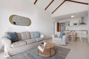 a living room with a couch and a table at Los Morros in Punta Mujeres