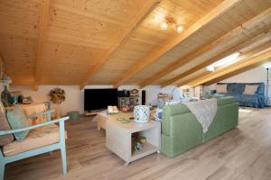 a living room with a couch and a table at Zante Villa Amici Loft in Zakynthos