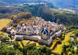 an aerial view of a castle on a hill at Charmant Duplex Pied De Pistes in Briançon
