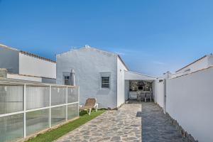 an external view of a house with a patio at Casa El Elefante in La Muela