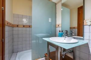 a bathroom with a sink and a shower and a tub at Le Chalet Sierra Nevada in Monachil +25 photos
