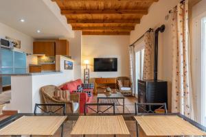 a living room with a couch and a table at Le Chalet Sierra Nevada in Monachil