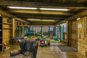 a room with a play room with a playground at Casa Rural Mas Fuselles in Girona +32 photos