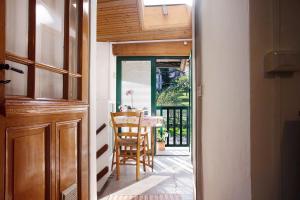 a door leading into a dining room with a table at La Vecchia Torre in Porto Valtravaglia